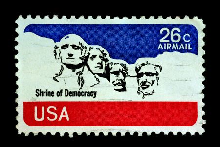 Shrine of democracy on USA stamp featuring mount rushmore national memorial . Stone Sculptures of George Washington, Thomas Jefferson, Theodore Roosevelt, and Abraham Lincoln.の写真素材