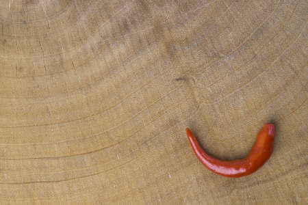 Chili on wood backgroundの写真素材