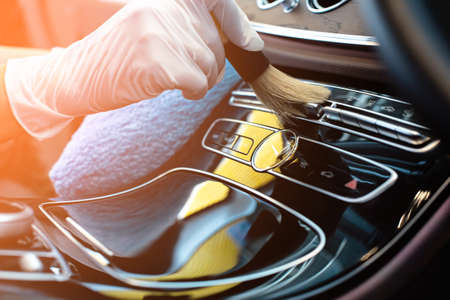 Luxury car interior cleaning by brush