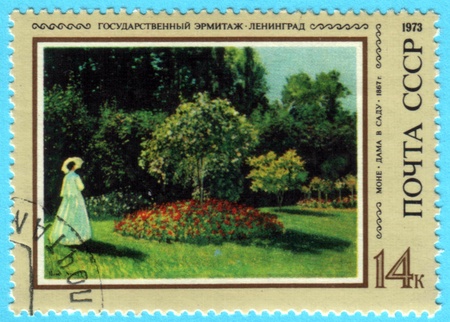 USSR - CIRCA 1973: A stamp printed in the USSR shows painting "Woman in a Garden" by artist Claude Monet, a stamp from collection Hermitage, circa 1973.のeditorial素材
