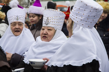 Kazakhstan,Petropavlovsk - MARCH 21, 2014: Muslim new year celebration.Three old women in national Kazakh costumesのeditorial素材