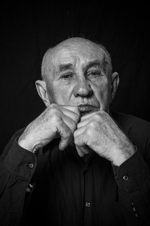 Monochrome stylized portrait of an expressive old manの写真素材