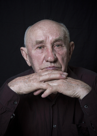 Monochrome stylized portrait of an expressive old man