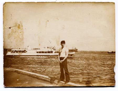 USSR - CIRCA 1930s: man on the background of the shipのeditorial素材