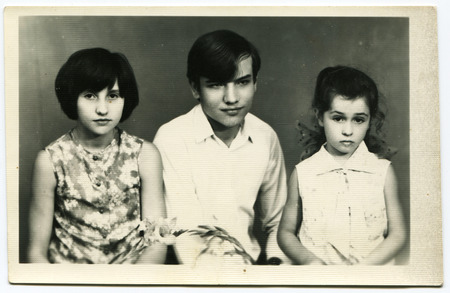 USSR - CIRCA 1970s: An antique photo shows studio portrait of a boy and two girl のeditorial素材
