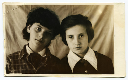 USSR - CIRCA 1970s: An antique photo shows studio portrait of a boy and girlのeditorial素材