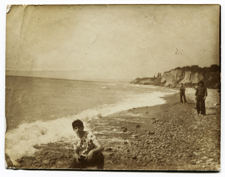 USSR - CIRCA 1970s: Antique photo shows young man on the beachのeditorial素材