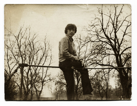   USSR - CIRCA 1980s : An antique photo shows young man at the barのeditorial素材