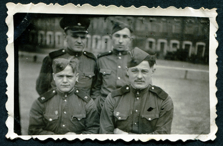 USSR - CIRCA 1953: An antique photo shows 4 soldersのeditorial素材