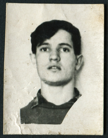 USSR - CIRCA 1960s: An antique photo shows studio portrait of a young manのeditorial素材