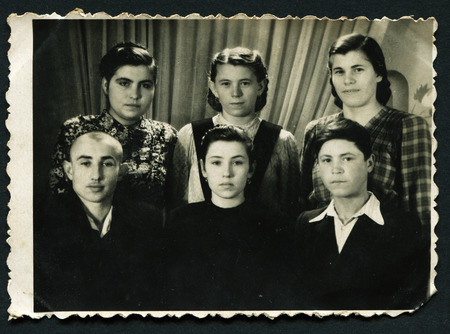 USSR - CIRCA 1953: An antique photo shows family portrait, 1953のeditorial素材