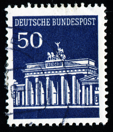 GERMANY - CIRCA 1966: A stamp printed in Germany shows Brandenburg Gate, Berlin, with the same inscription, from the series "Brandenburg Gate", circa 1966のeditorial素材