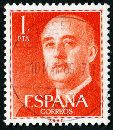 SPAIN - CIRCA 1955: Orange color postage stamp printed in Spain with portrait image General Francisco Franco.のeditorial素材