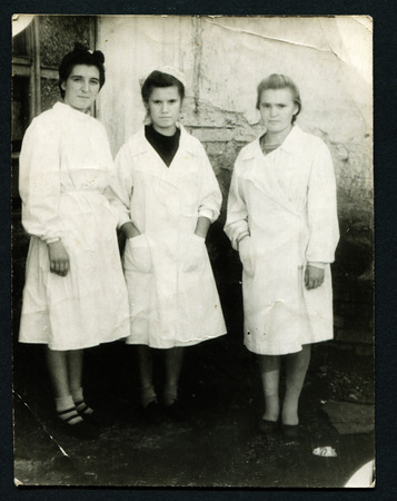 USSR - CIRCA 1950s: An antique photo shows three women in white coats, USSR, circa 1950sのeditorial素材