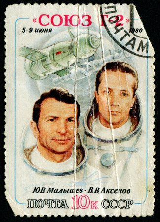 USSR - CIRCA 1980: A stamp printed in the USSR shows Soviet cosmonauts Malyshev and Aksenov and spacecraft Soyuz T-2, circa 1980.のeditorial素材