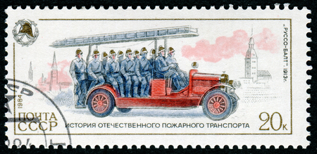 USSR-CIRCA 1984: A post stamp printed in USSR show firemen Russo-Balt , devoted history of fire transport, circa 1984.のeditorial素材