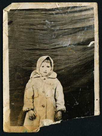 USSR - CIRCA 1960s: An antique photo shows little girl in a fur coat, circa 1960s