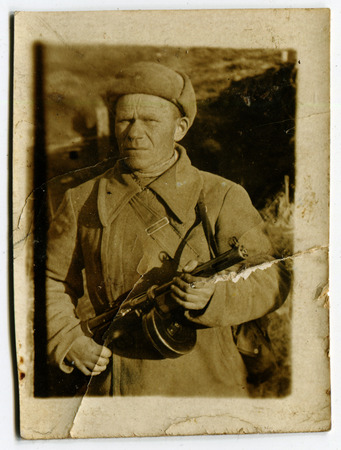 USSR - CIRCA 1942: Vintage photo shows soviet soldier with automatic, 1942のeditorial素材