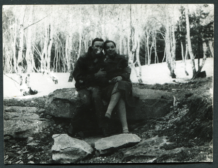 USSR - CIRCA 1970s: An antique photo show Man and woman sitting on a rock in the forest