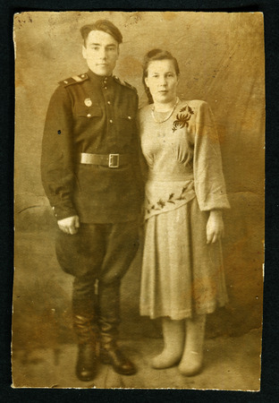 USSR - CIRCA 1940s: Antique photo shows portrait of a Soviet officer and his wife