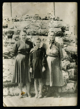 USSR - CIRCA 1950s: An antique photo show grandmother with two grandchildrenのeditorial素材