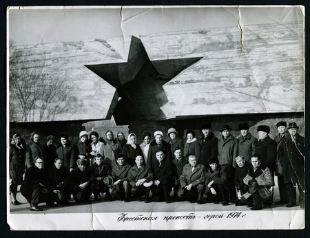 USSR - CIRCA 1974: An antique photo shows Group of tourists on the background of the Brest Fortress, USSR, circa 1974のeditorial素材