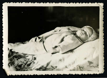 USSR - CIRCA 1960s: An antique photo shows little babyのeditorial素材