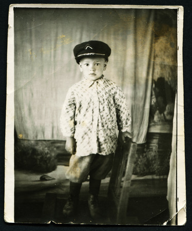 USSR - CIRCA 1970: An antique photo shows portrait of little boy in a capのeditorial素材