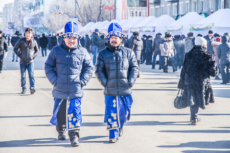 PETROPAVLOVSK, KAZAKHSTAN - MARCH 21, 2015: celebration of the new year on the solar calendar astronomical in Iranian and Turkic peoples. two men in national robesのeditorial素材