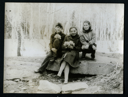USSR - CIRCA 1970s: An antique photo shows three women sitting on a rock in the forest