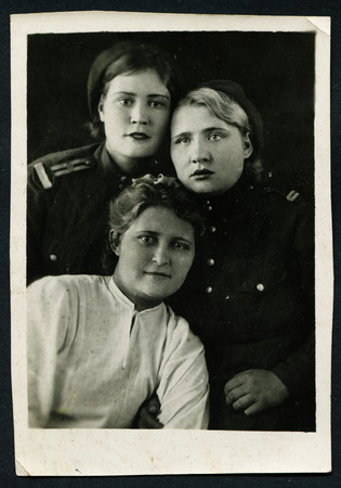 Ussr - CIRCA 1970s: An antique Black & White photo show portrait of three women during the Second World Warのeditorial素材