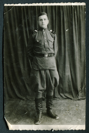 USSR - CIRCA 1950s: the photo made in the USSR, represents the young man in the form of the private of the Soviet Army, circa 1950sのeditorial素材