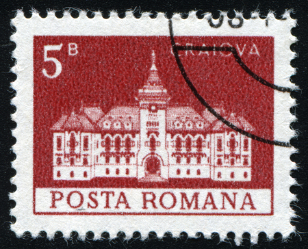 ROMANIA - CIRCA 1973: A stamp printed in Romania shows City Hall in Craiova, with the same inscription, from the series "Buildings&quo t;, circa 1973のeditorial素材