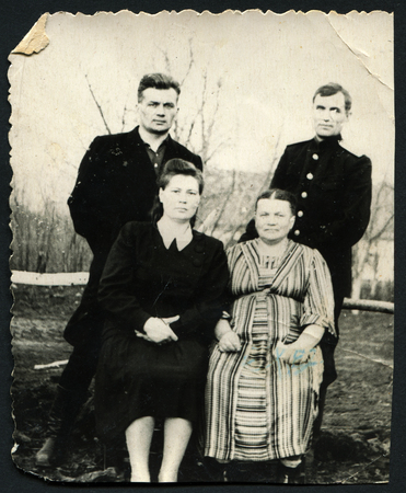 Ussr - CIRCA 1970s: An antique Black & White photo show family portrait in outdoorのeditorial素材