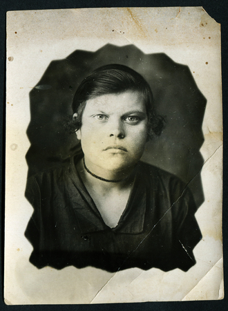 Ussr - CIRCA 1970s: An antique Black & White photo show Studio portrait of a young womanのeditorial素材