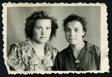 Ussr - CIRCA 1970s: An antique Black & White photo show studio portrait of two womenのeditorial素材