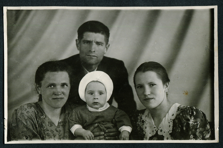 USSR - CIRCA 1980s: An antique photo shows studio family portraitのeditorial素材