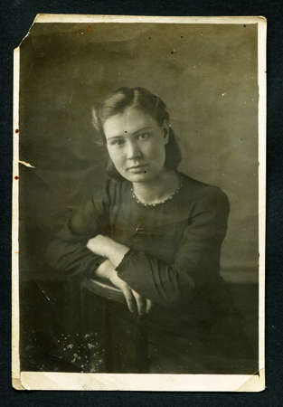 Ussr - CIRCA 1930s: An antique Black & White photo show portrait young womanのeditorial素材