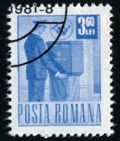 ROMANIA - CIRCA 1971: A stamp printed in Romania shows a postman collecting the mail, circa 1971.のeditorial素材