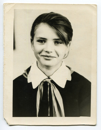 USSR - CIRCA 1975: An antique photo shows portrait of a beautiful schoolgirl.のeditorial素材