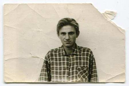 Ussr - CIRCA 1980s: An antique Black & White photo show portrait of young manのeditorial素材