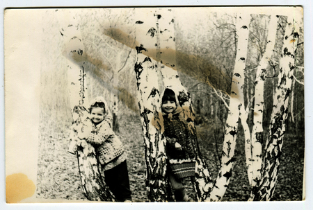 Ussr - CIRCA 1970s: An antique Black & White photo show two girls gather mushroomsのeditorial素材