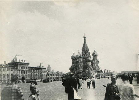 MOSCOW - CIRCA 1984: A group of tourists on Red Square background of the monument to Minin and Pozharsky and St Basil's Cathedral, Moscow, USSR, 1984のeditorial素材