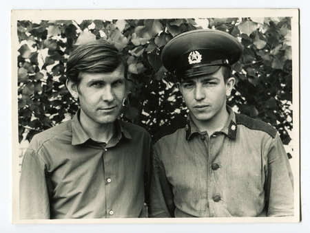 Ussr - CIRCA 1990s: An antique Black & White photo show two soldierのeditorial素材