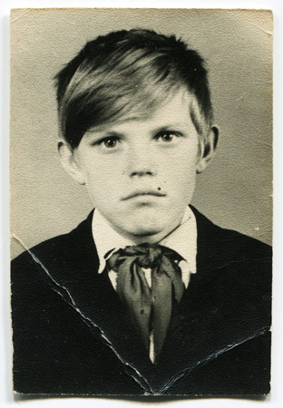 USSR - CIRCA 1970s: An antique photo show boy pioneer, USSR, circa 1970sのeditorial素材