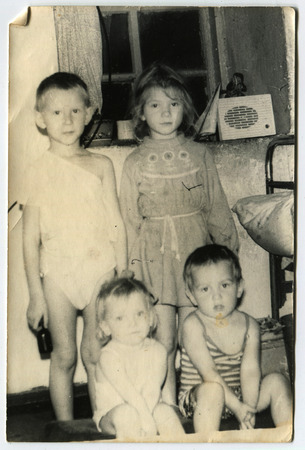USSR - CIRCA 1960s: An antique photo shows Four small children, USSR, circa 1960sのeditorial素材