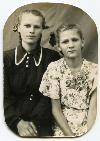 USSR - CIRCA 1950s: An antique photo shows  two sisters, USSR, circa 1950sのeditorial素材
