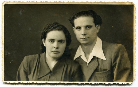 USSR - CIRCA 1960s: An antique photo shows a young couple, USSR, circa 1960sのeditorial素材