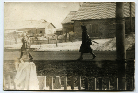 USSR - CIRCA 1980s: An antique photo show girl walking on the street, USSR, circa 1980sのeditorial素材