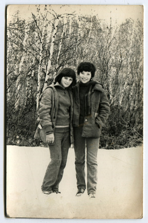 USSR - CIRCA 1960s: An antique photo shows two girls in the winter forest, USSR, circa 1960sのeditorial素材
